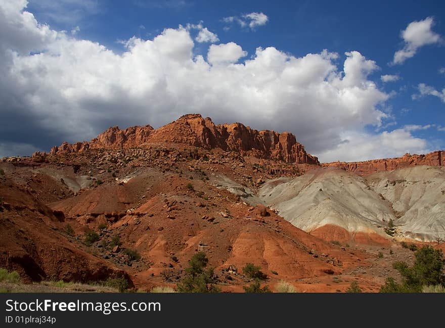 View of red rock formations in San Rafael Swell with blue sky�s the and clouds