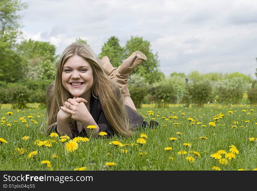 Young Adult Beautiful Girl Lying On Grass