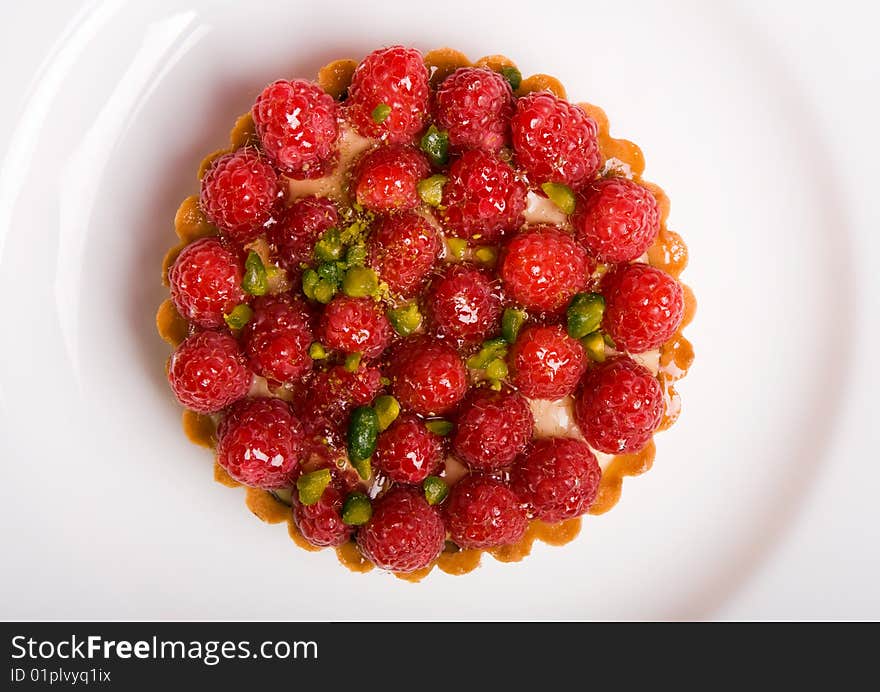 Raspberry cake on the white plate