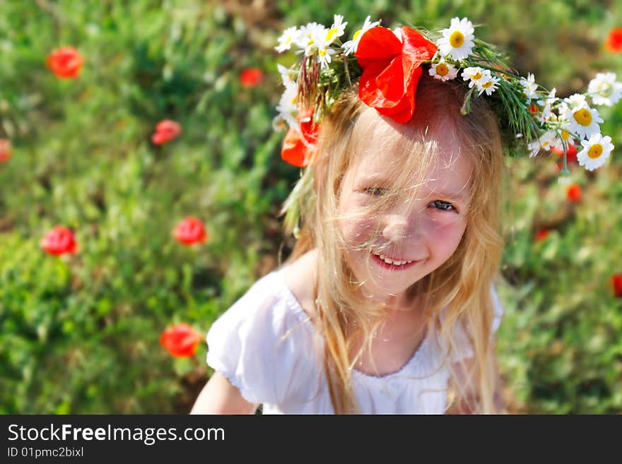 Cute funny girl in floral wreath