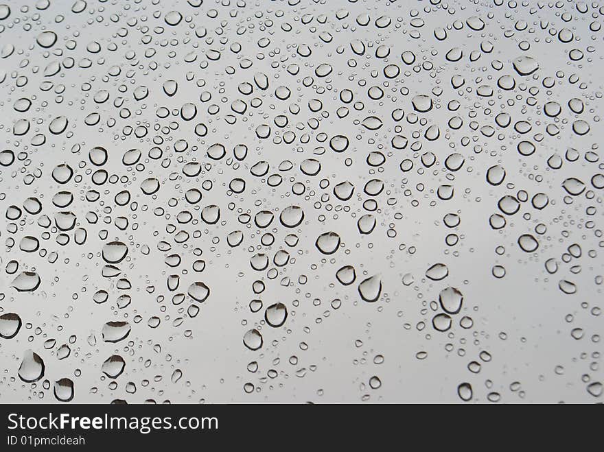 Rain drops on grey background