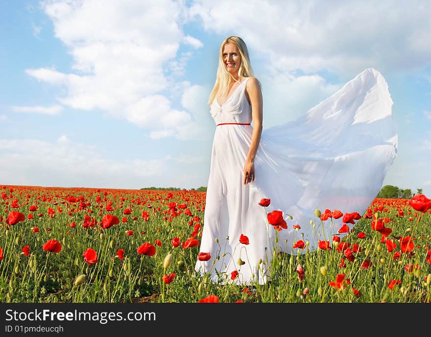 Young beautiful woman in white dress