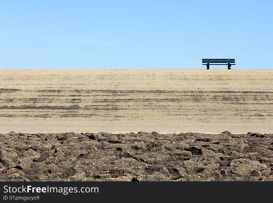 Lonely bench on a dike