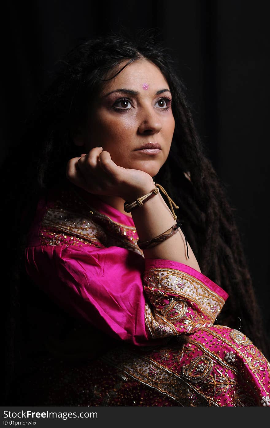 A beautiful Indian woman wearing a traditional sari