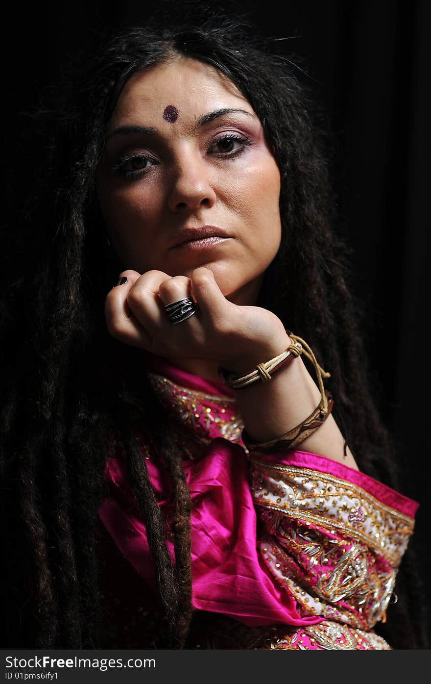 A beautiful Indian woman wearing a traditional sari