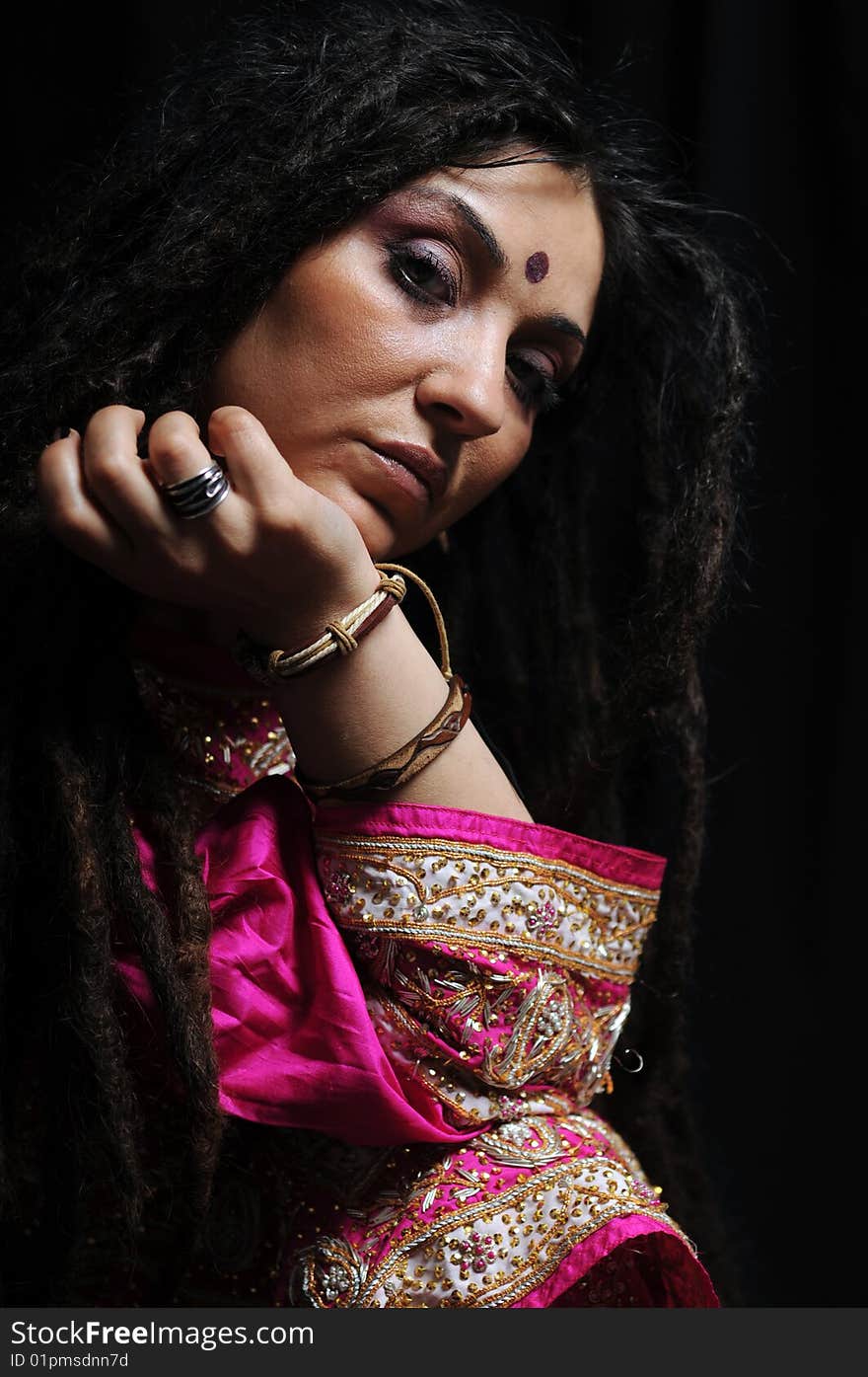 A beautiful Indian woman wearing a traditional sari