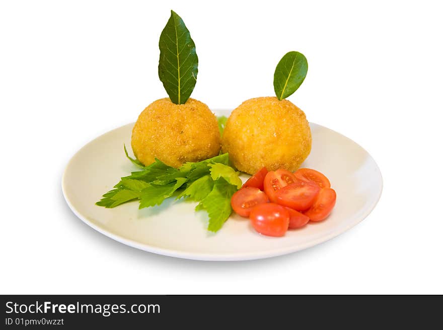 Rice meatballs decorated with cherry tomatoes, celery and bay laurel. Italian food. Rice meatballs decorated with cherry tomatoes, celery and bay laurel. Italian food