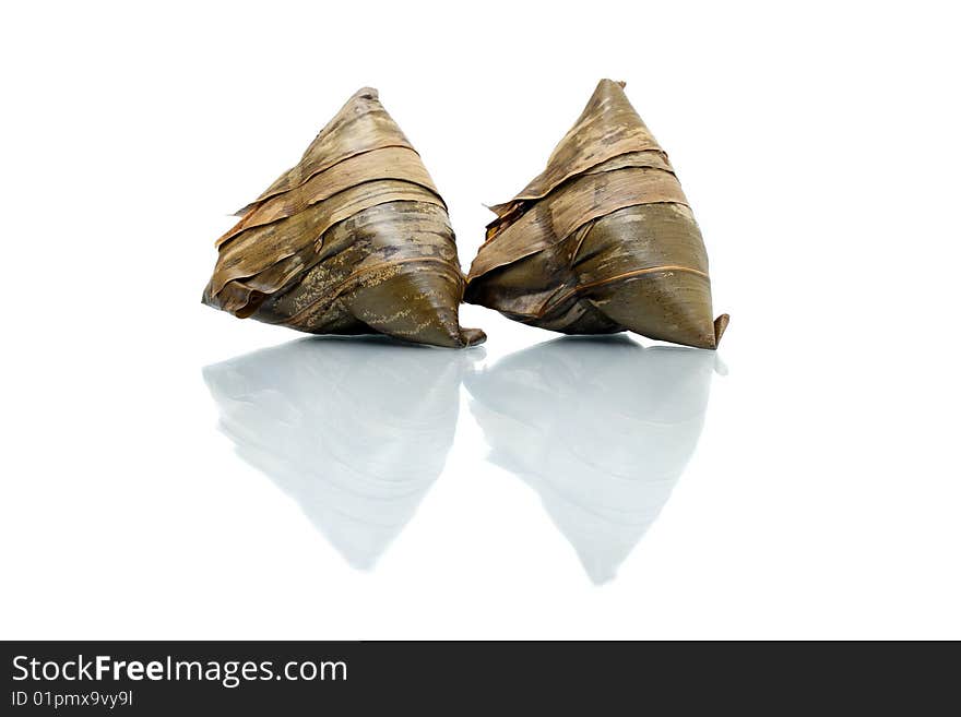 Two rice dumplings (Chinese traditional food) isolated on white background. Two rice dumplings (Chinese traditional food) isolated on white background.