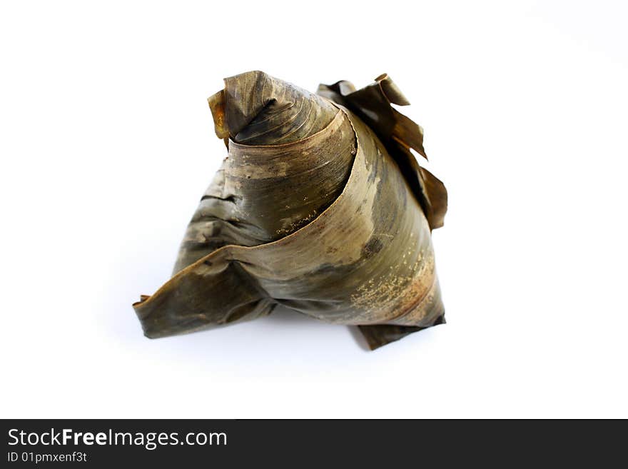 A rice dumplings (Chinese traditional food) isolated on white background. A rice dumplings (Chinese traditional food) isolated on white background.