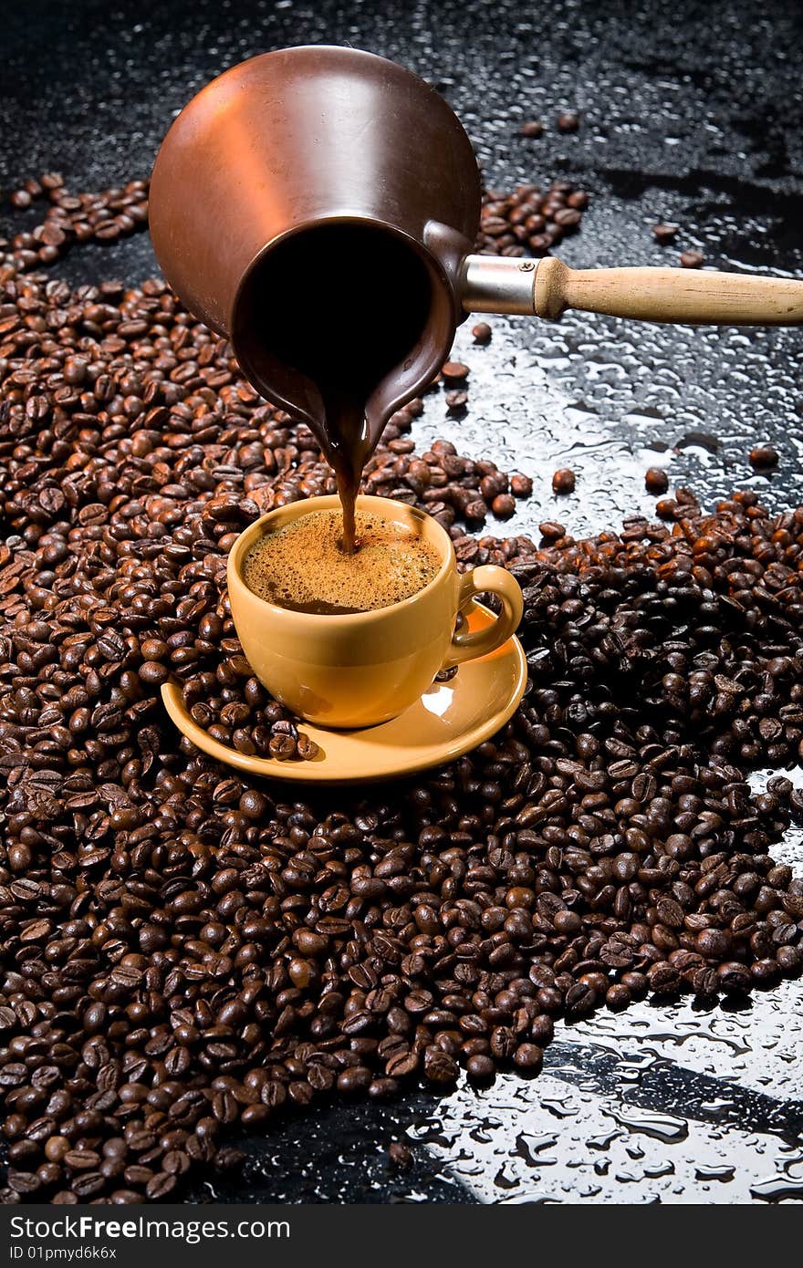 Coffee beans, pot and yellow cup