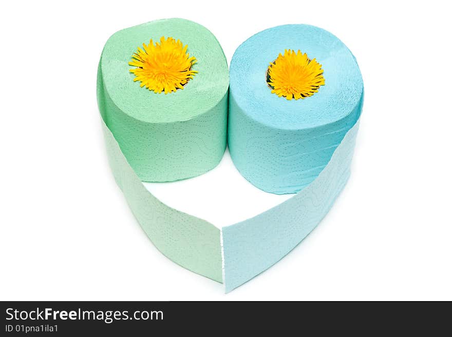 Two rolls of the toilet paper in the manner of heart with yellow colour