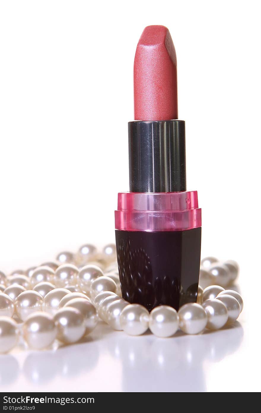 A pink lipstick with perl on white