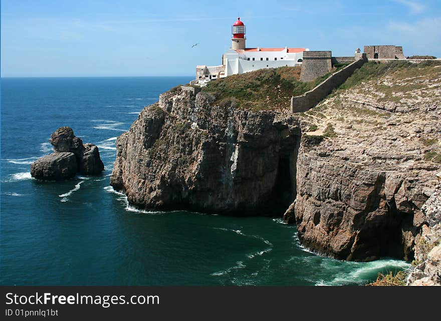 Lighthouse on a rock coast. Lighthouse on a rock coast