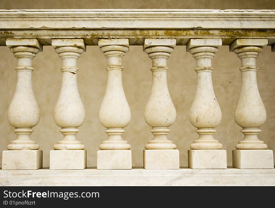 A row of pillars decorate a church - shot in Italy