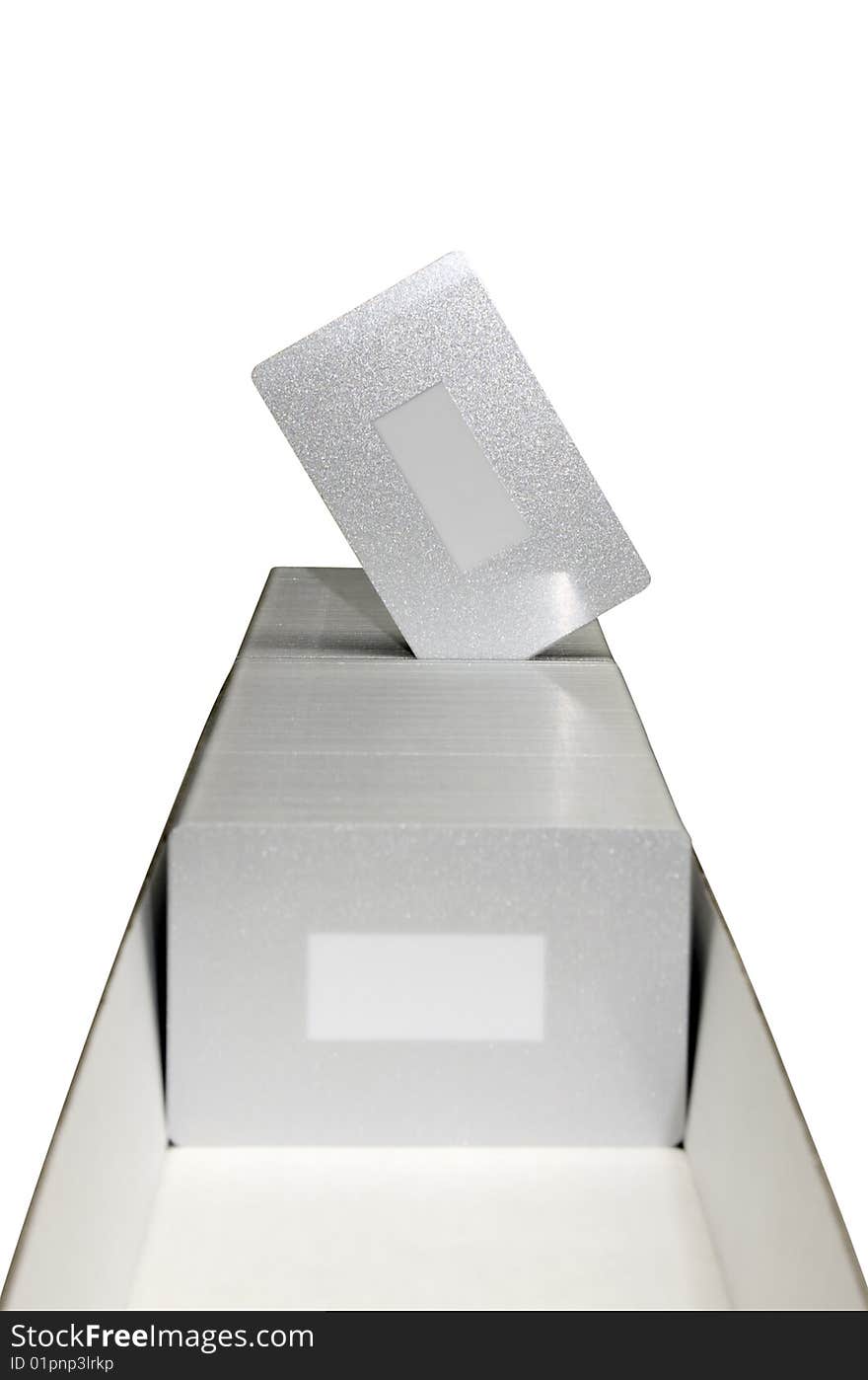 Silver plastic cards are placed in a box (isolated). Silver plastic cards are placed in a box (isolated)