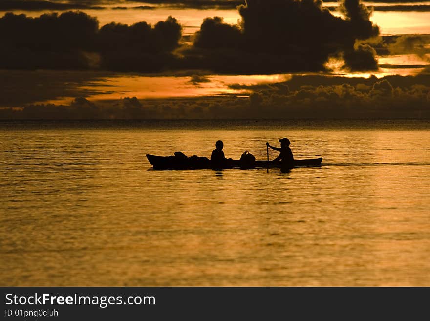 Fishermen at dusk silhouette