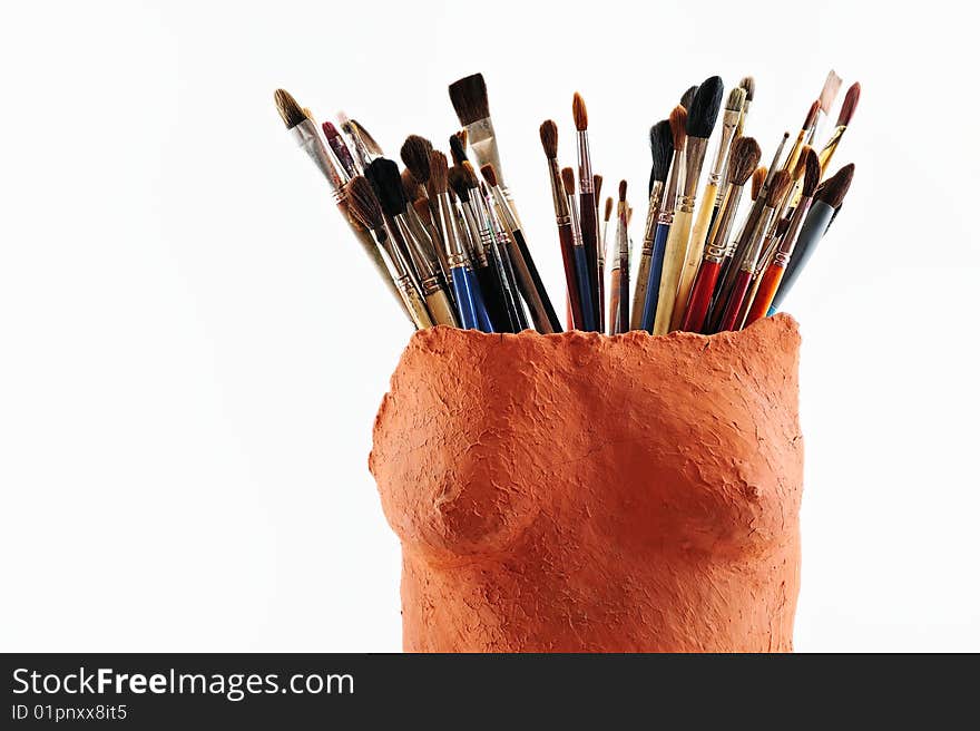 Collection of paintbrush in the ceramic vase. Collection of paintbrush in the ceramic vase