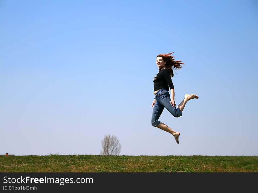 The girl taken in a jump like hanging in the air. The girl taken in a jump like hanging in the air