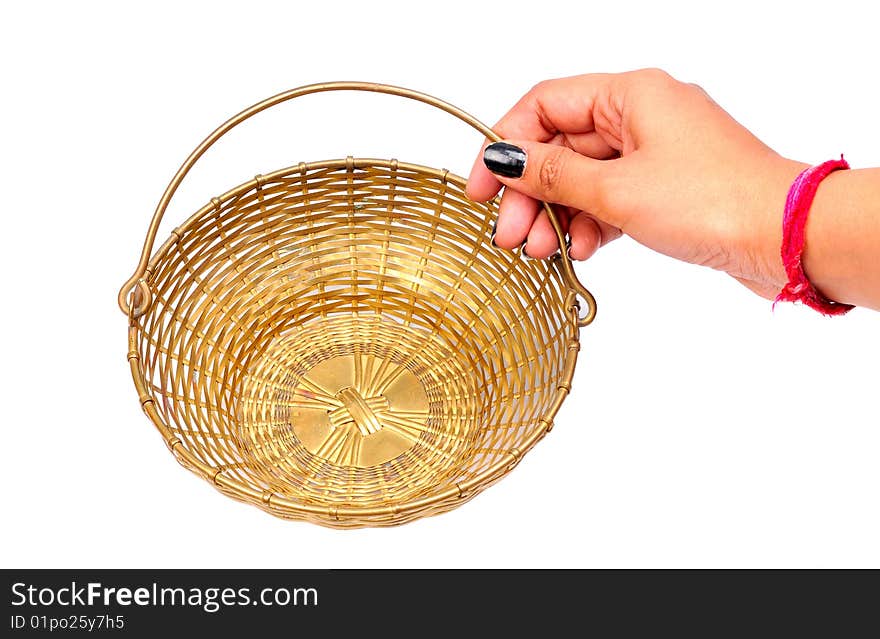 Female hand holding basket isolated on white background.