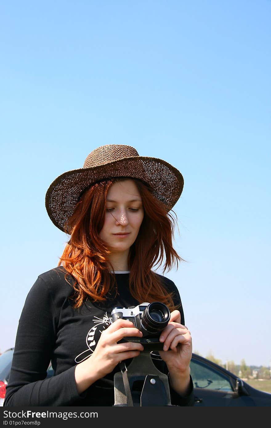 The Girl In The Hat With The Camera