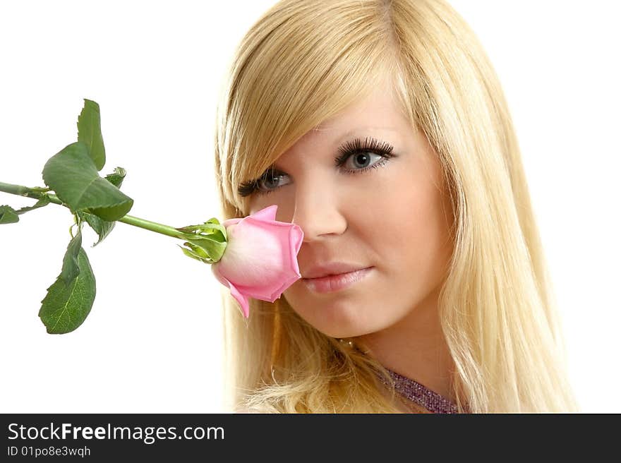 The beautiful girl with a flowing hair and a rose