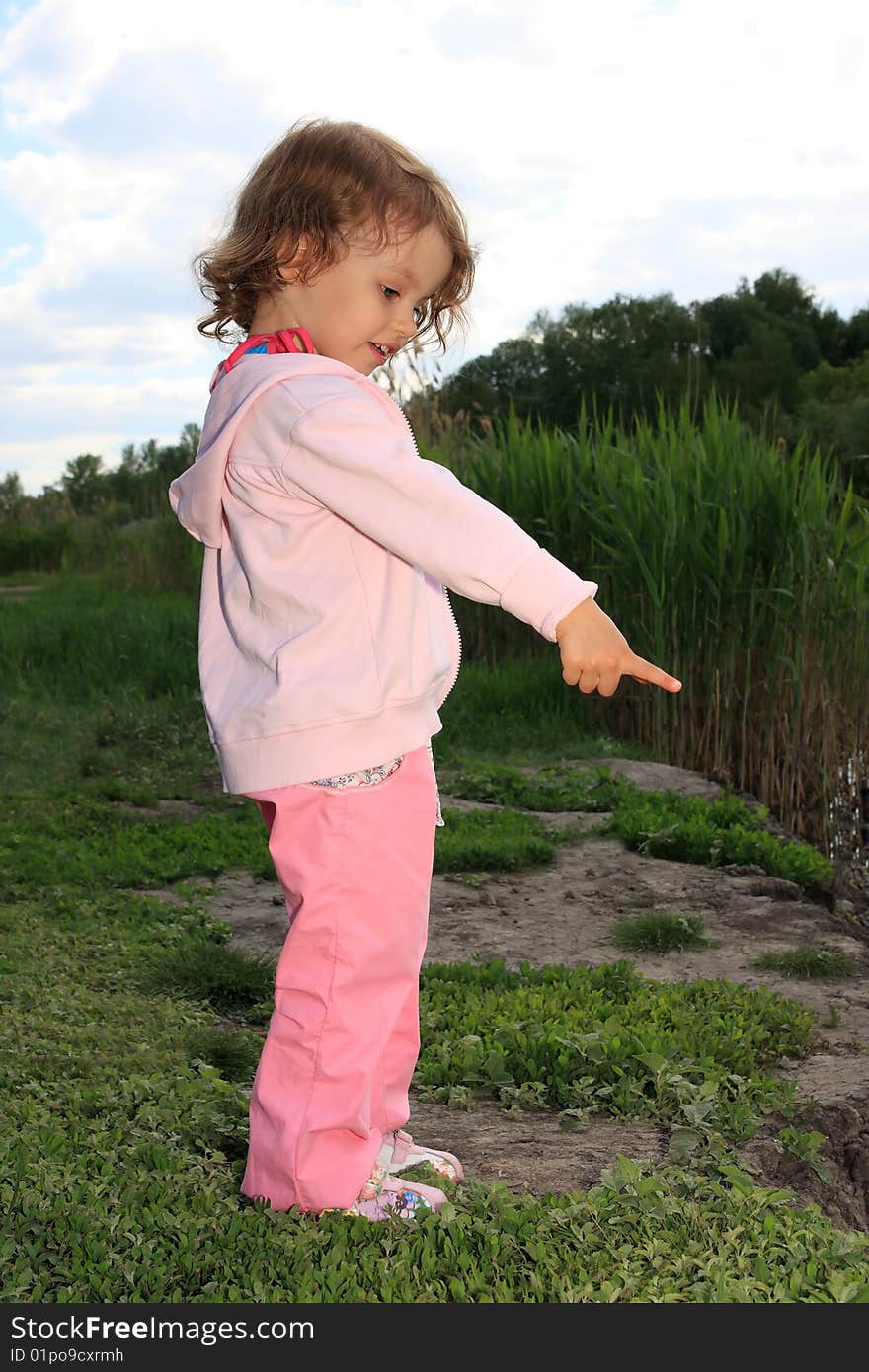 Girl ashore lake.