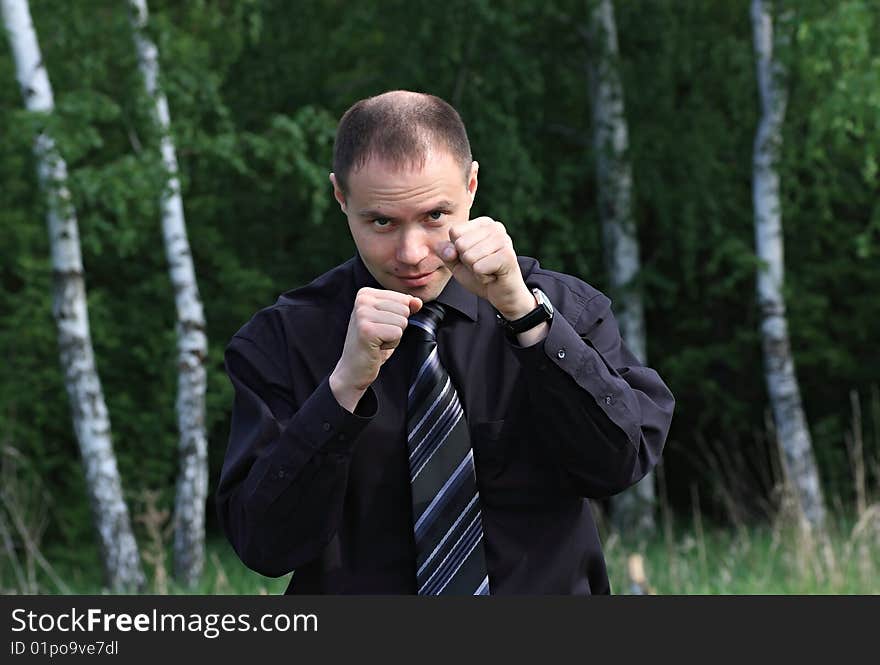 A businessman boxes