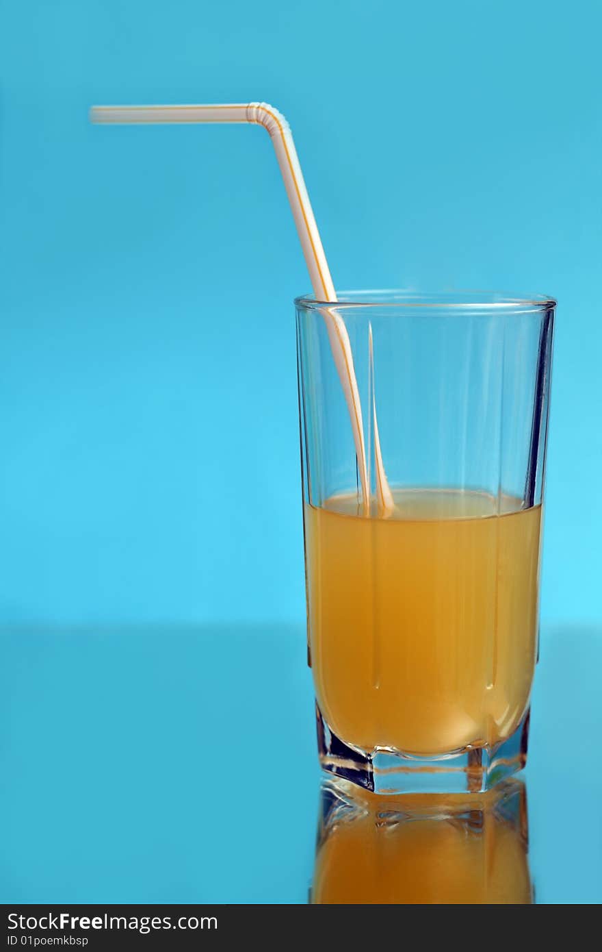 A tall glass of orange juice