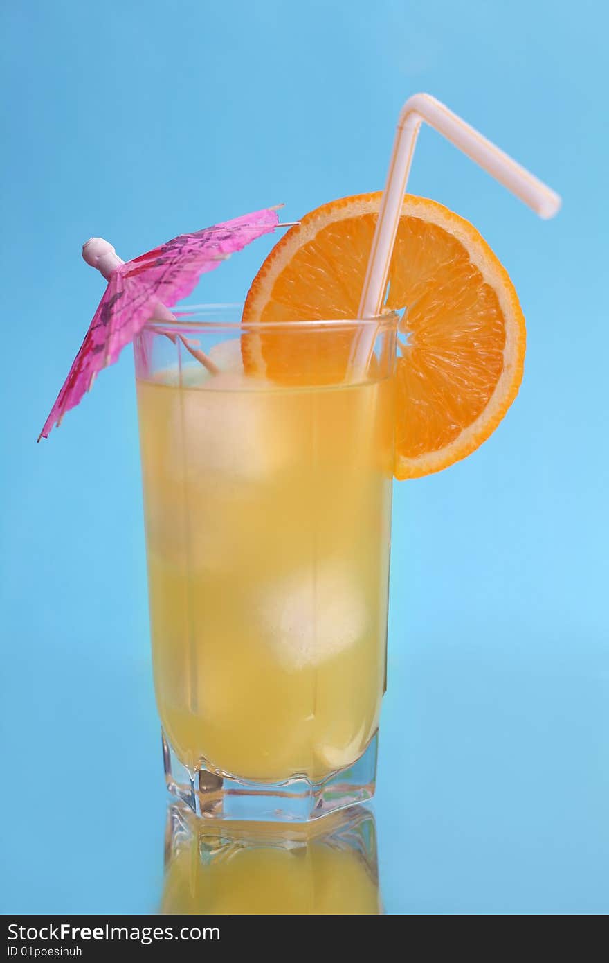 A tall glass of orange juice