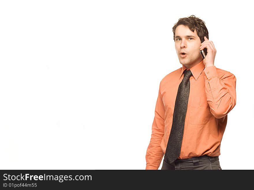 Young, good looking businessman standing in front of a white background. Young, good looking businessman standing in front of a white background