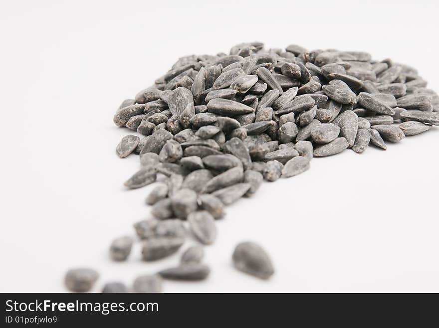 Sunflower seeds isolated over white background