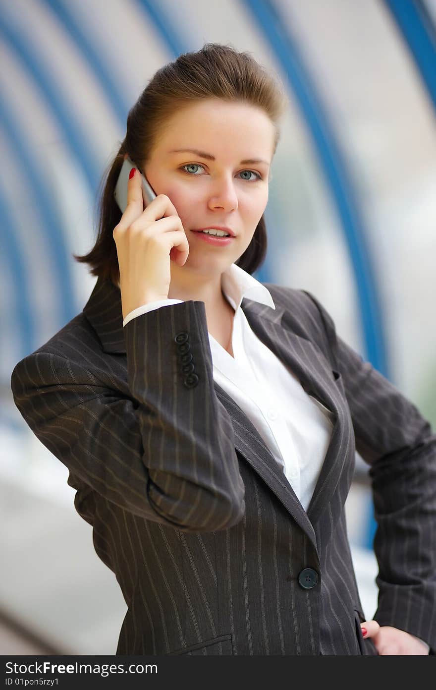 Modern professional businesswoman with phone