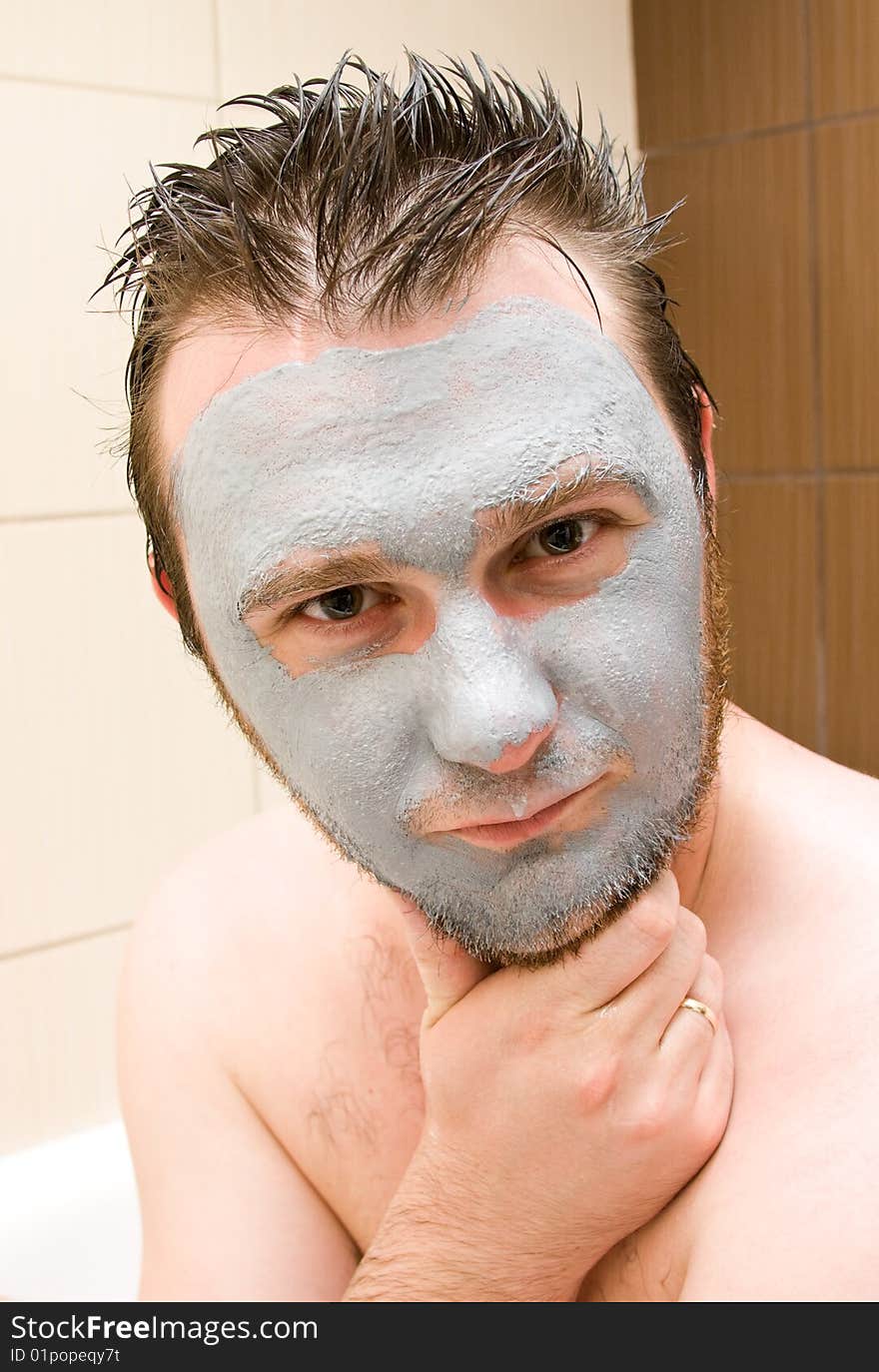 Young man with facial mask. Young man with facial mask