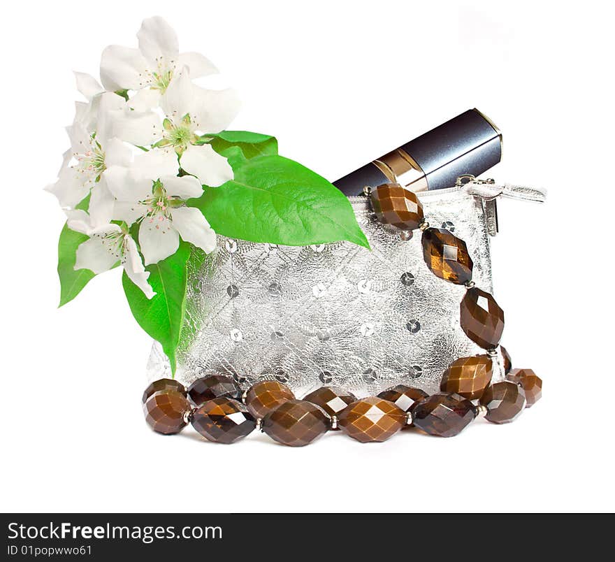 Cosmetics bag with flowers isolated on white background