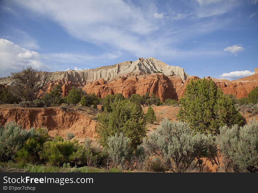 View of the red rock formations in Kodachrome Basin with blue skys and clouds