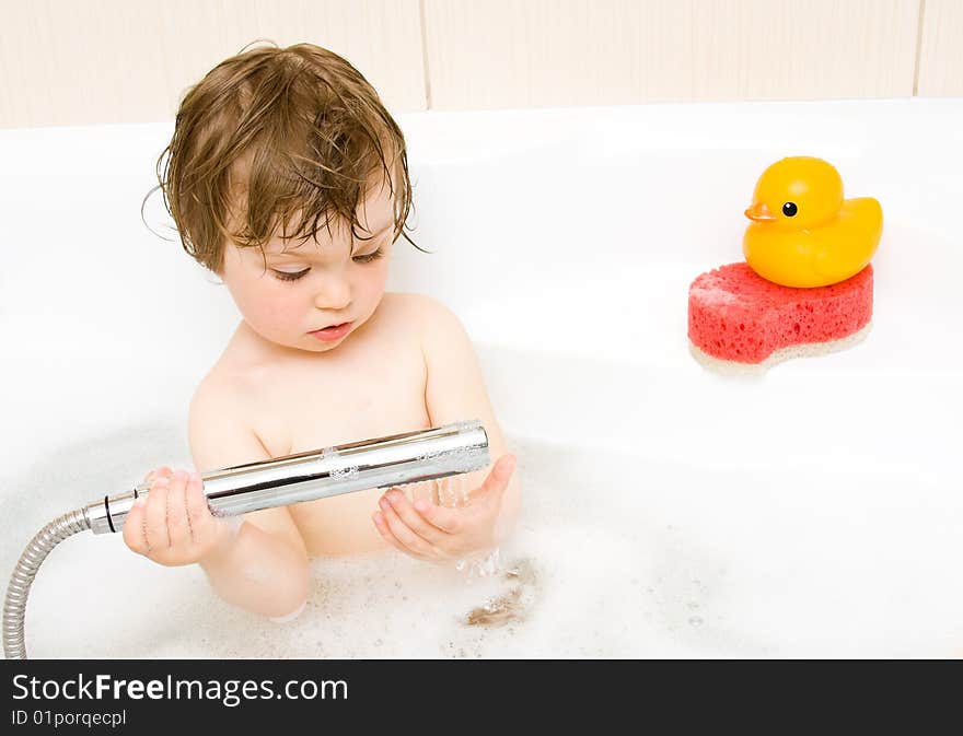 Sweet toddler baby girl in bath