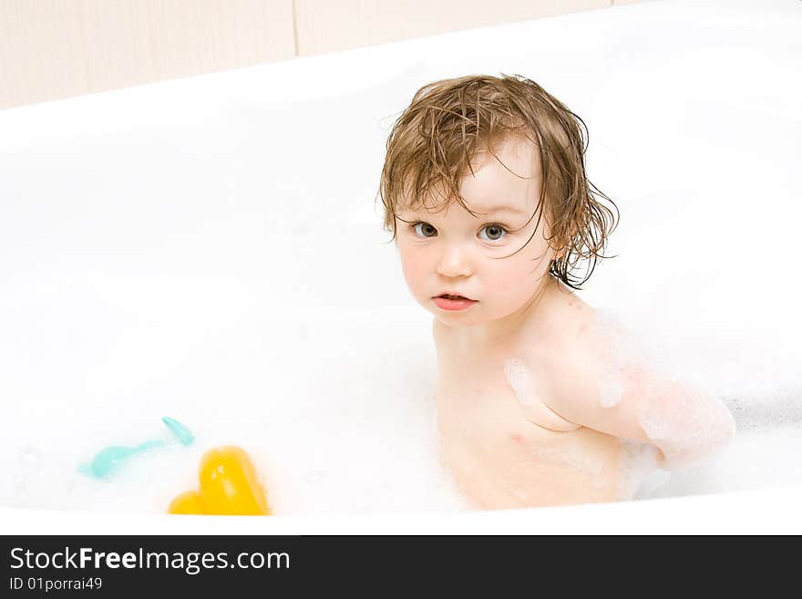 Sweet toddler baby girl in bath