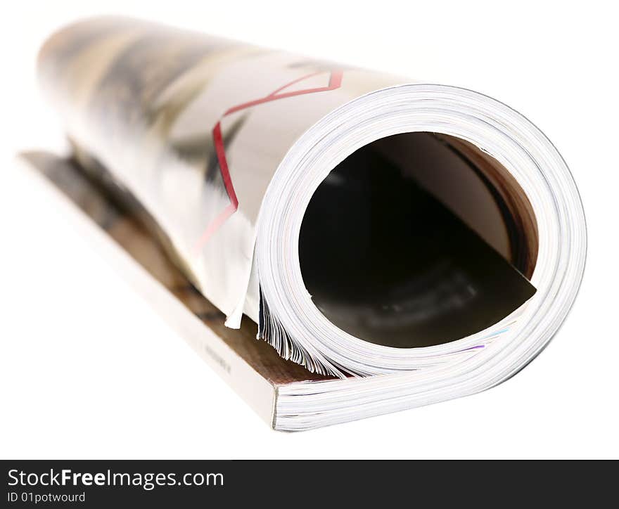 Woman's rolled glossy magazine on white background