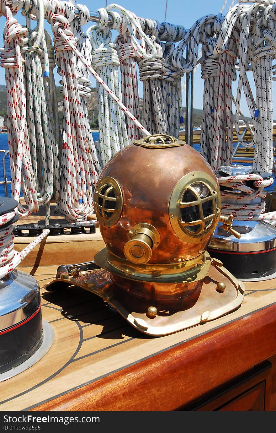 Antique diving mask on the boat deck