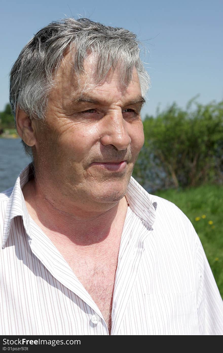 Portrait of a grey mature man in summer