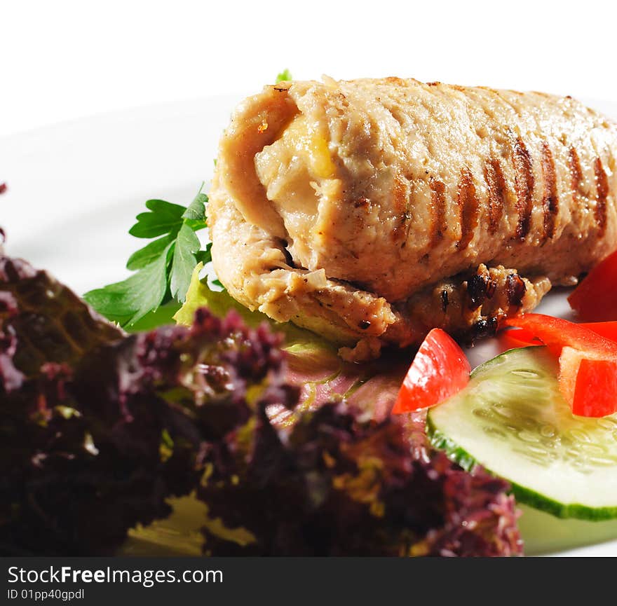 Pork (or Beef) Grilled Roll with Greens and Vegetables on a Plate. Pork (or Beef) Grilled Roll with Greens and Vegetables on a Plate