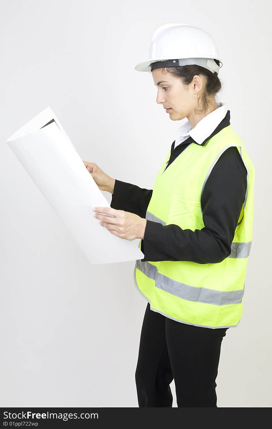 Engineer checking a project in front of white background. Engineer checking a project in front of white background