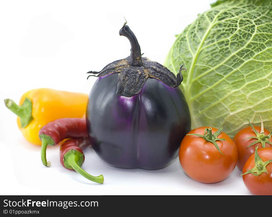 Cabbage, pepper, eggplant and tomatoes isolated on white background