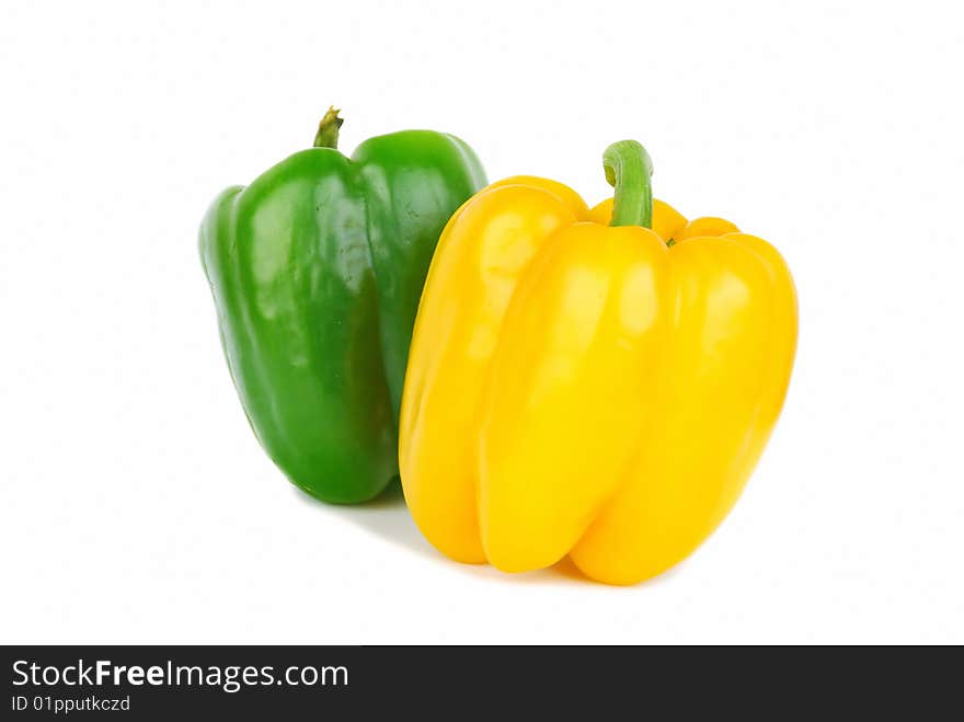 Two of brightly colored capsicums paprika isolated on white. Two of brightly colored capsicums paprika isolated on white.