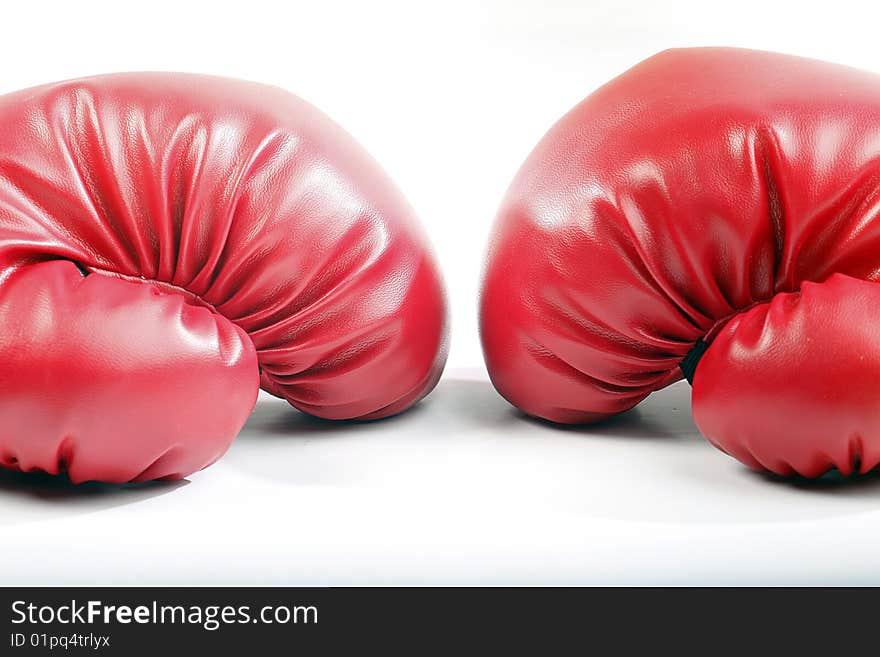 Red boxing gloves on a white back ground