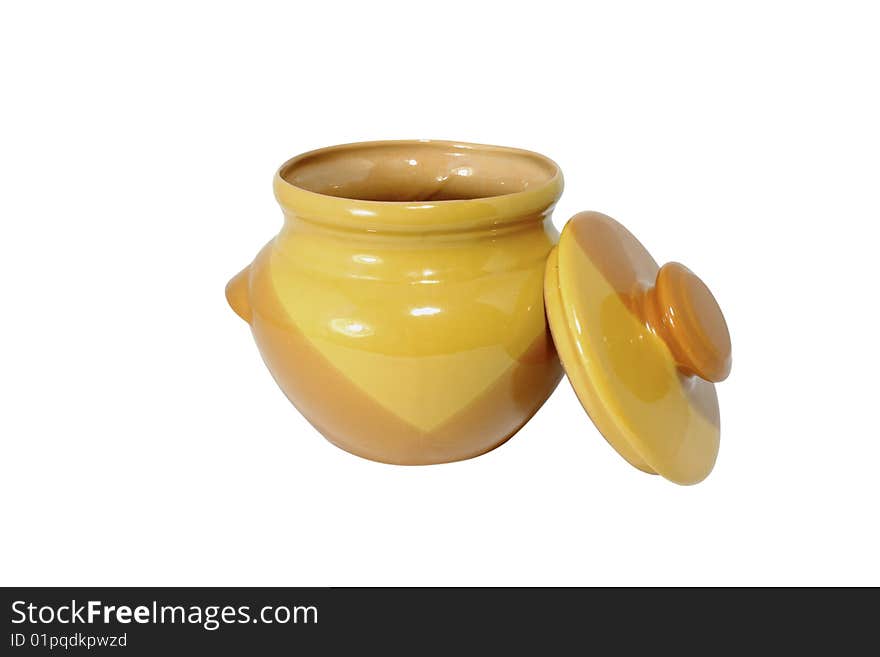 Clay, yellow pot with a cover, located on the isolated white background. Clay, yellow pot with a cover, located on the isolated white background