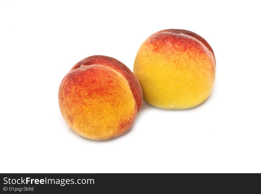 Two isolated peaches