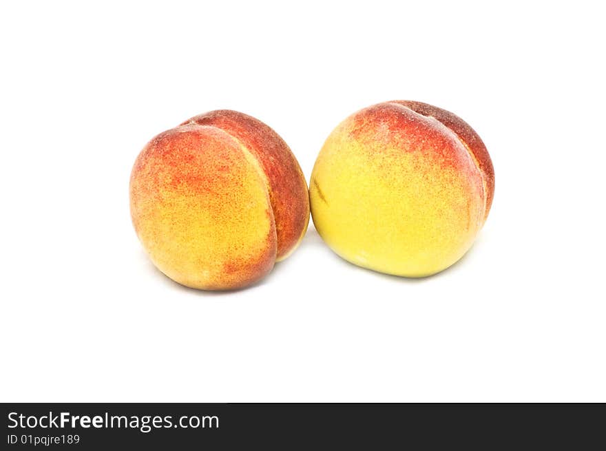 Two isolated peaches