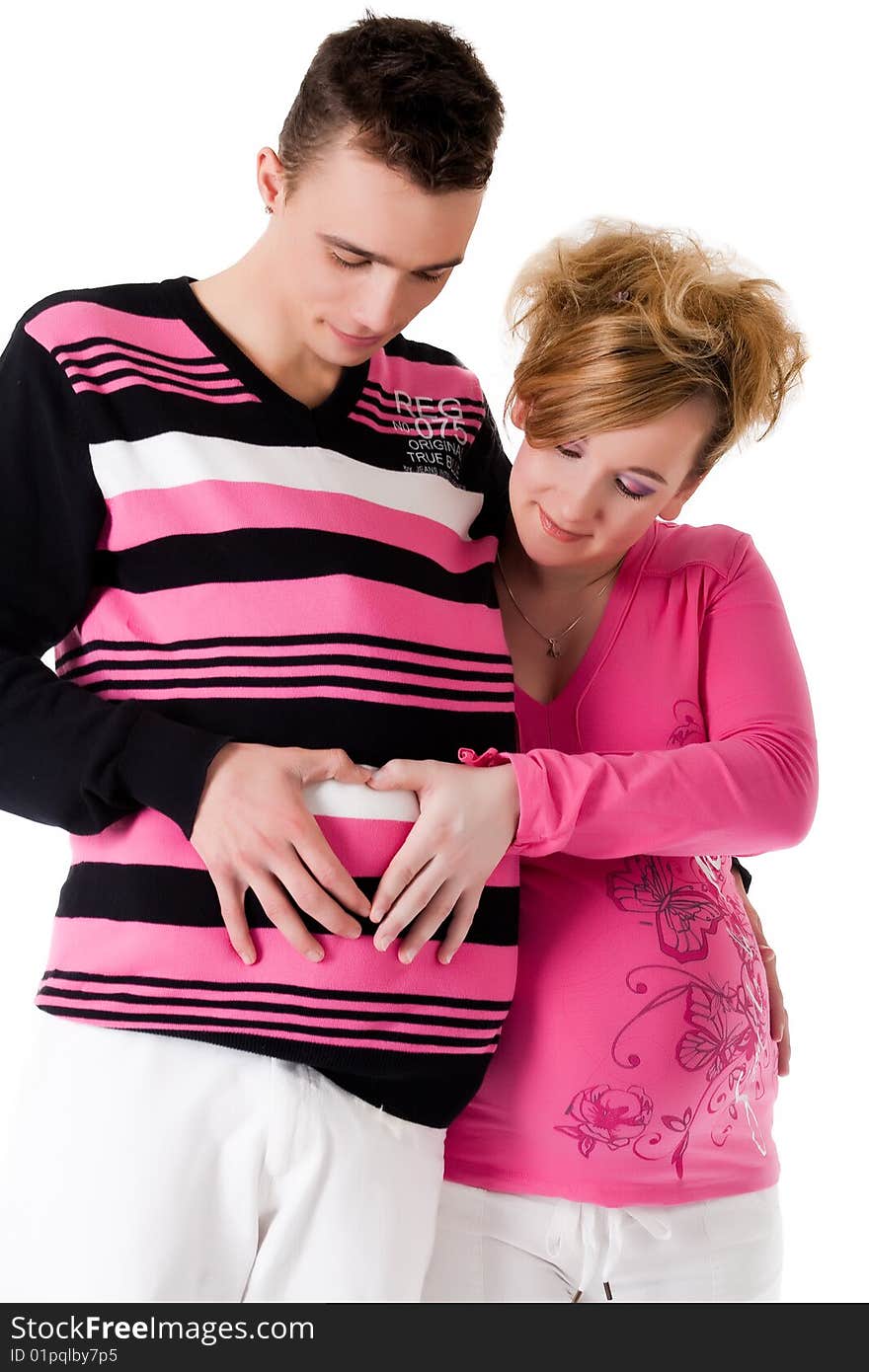 Young lovely caucasian couple expecting their baby. Young lovely caucasian couple expecting their baby