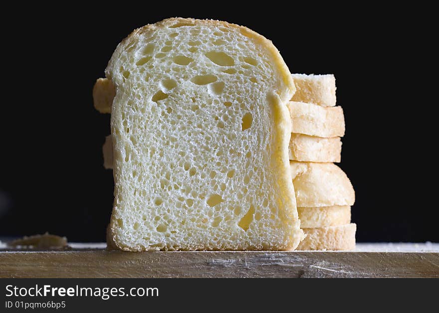 Close up of bread slices on a black background